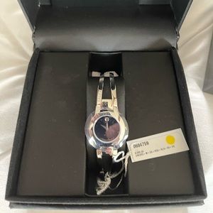Women’s Movado watch, Quartz, All Steel, Sapphire Crystal.